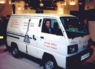 Dan, owner of India Street Antiques, sitting in a van ready to head out on a shopping excursion to purchase items for the next container from Europe. Early 1990s.