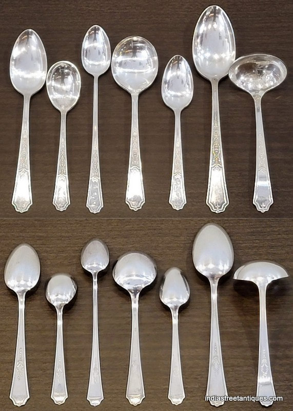 Various spoons and ladles in sterling silver plate from the "Ancestral" pattern.