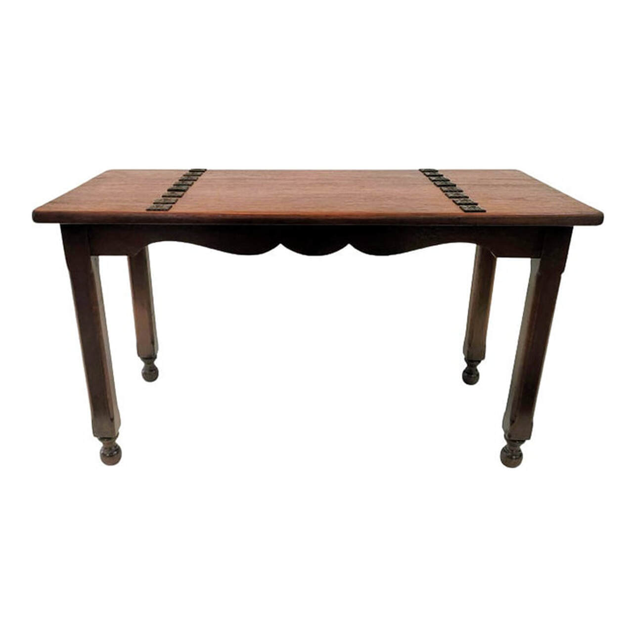 Vintage 1920s Spanish Revival coffee table made by McClellan Manufacturing Company of Los Angeles, California. The coffee table is crafted from solid Spanish Cedar. The top is embellished with sixteen black wrought iron square medallions screwed down to the wood, eight across on each side. Under the top is a brass furniture label stating the table was