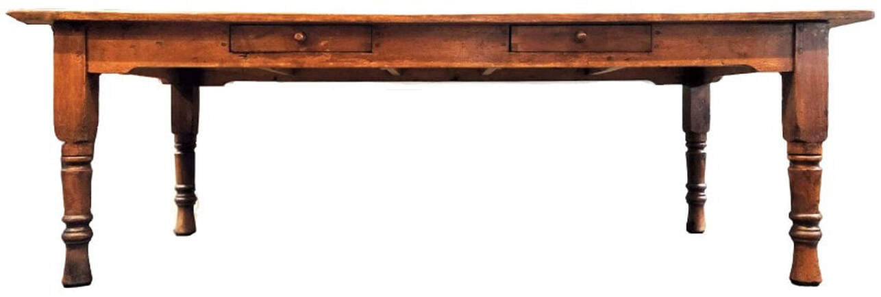 Classic 19th-century type kitchen work table is in a form favored in the Victorian decades of the 1850s through the 1880s. The table is constructed with wooden pegs and pine wood - one of the woods known as